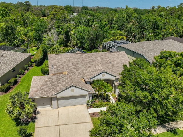 aerial view featuring a wooded view