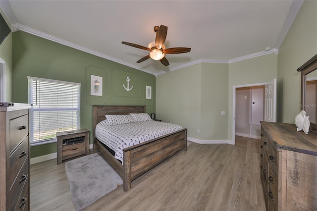bedroom with crown molding, baseboards, ceiling fan, and light wood finished floors