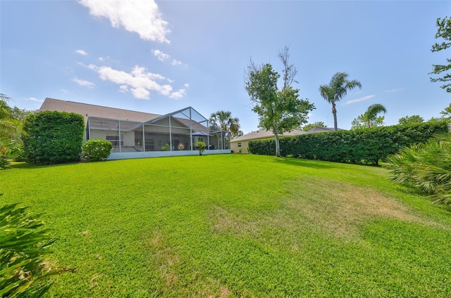 view of yard with a lanai