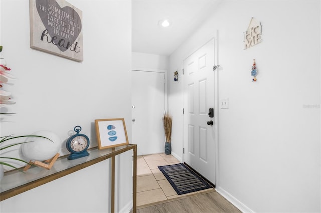 entryway featuring light tile patterned floors