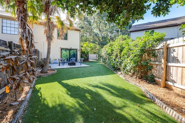 view of yard featuring a patio and a fenced backyard
