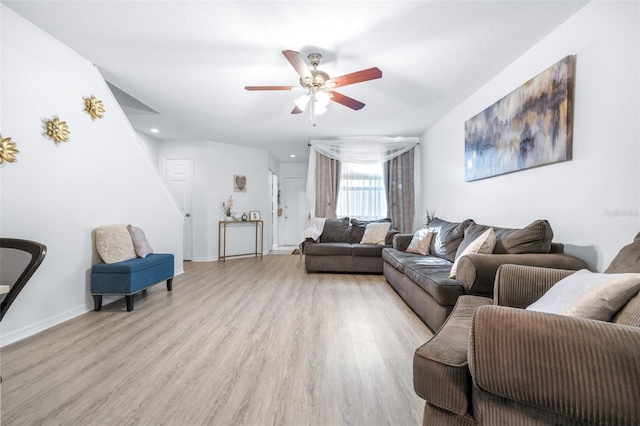 living area with light wood-style floors, recessed lighting, baseboards, and ceiling fan