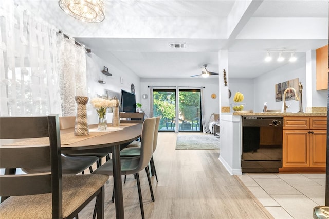 dining area featuring a ceiling fan, light wood-style flooring, and visible vents