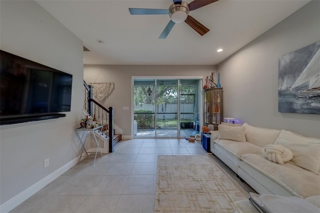 tiled living room featuring baseboards, a ceiling fan, recessed lighting, and stairway