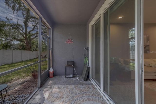 unfurnished sunroom with a wealth of natural light