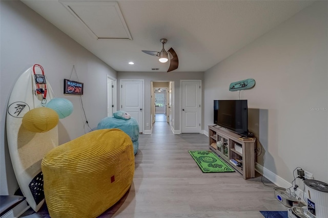 interior space featuring recessed lighting, baseboards, ceiling fan, and wood finished floors