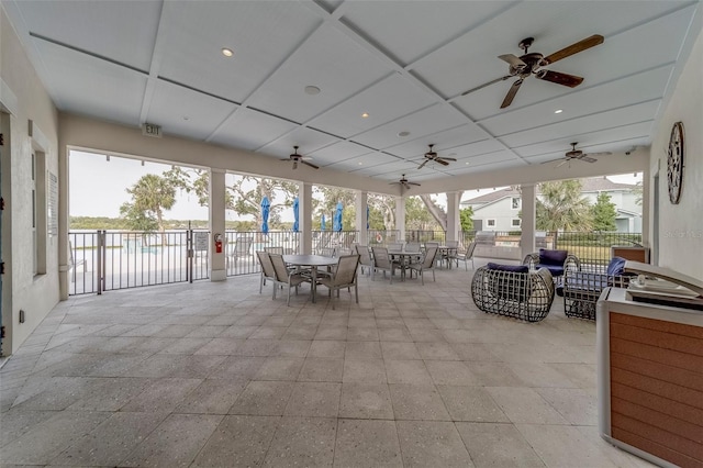 view of patio / terrace featuring ceiling fan, fence, and outdoor dining space