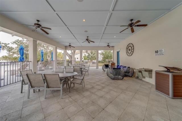 view of patio with ceiling fan and outdoor dining area