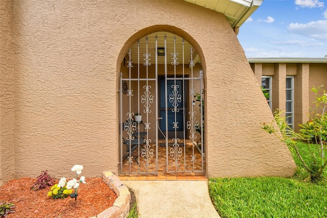 8225 Medford Dr, Port Richey, FL 34668 - doorway to property with stucco siding