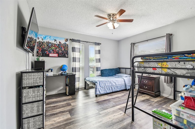 8225 Medford Dr, Port Richey, FL 34668 - bedroom featuring wood finished floors, a textured ceiling, and ceiling fan