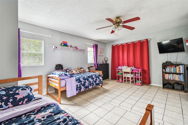 8225 Medford Dr, Port Richey, FL 34668 - tiled bedroom featuring a textured ceiling, multiple windows, and a ceiling fan