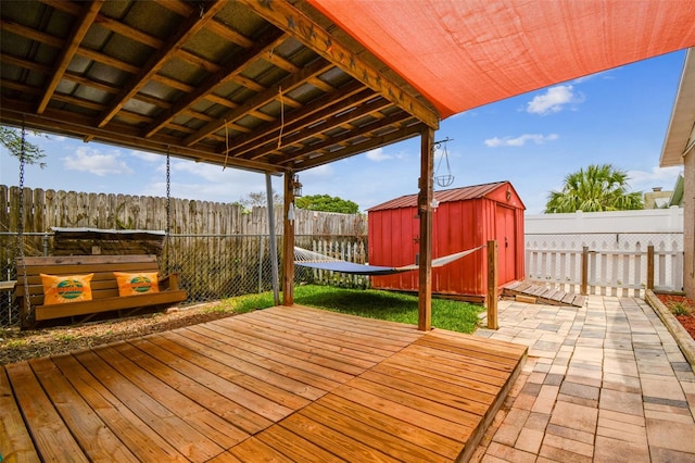 8225 Medford Dr, Port Richey, FL 34668 - deck with a storage unit, an outbuilding, and a fenced backyard