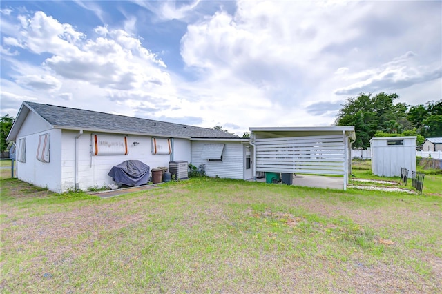 back of house with a yard, fence, and cooling unit