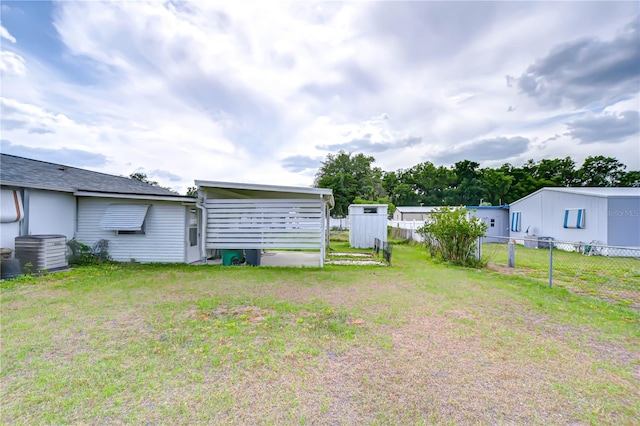 view of yard featuring fence and cooling unit