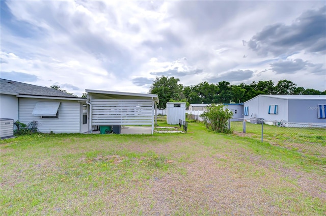 view of yard with fence and cooling unit