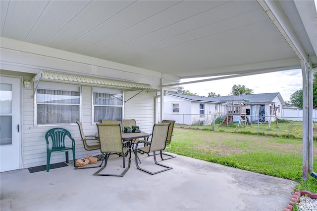 view of patio with outdoor dining area and a fenced backyard