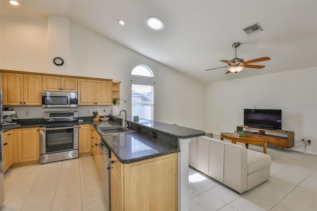 6332 35th Avenue Cir E, Palmetto, FL 34221 - kitchen with appliances with stainless steel finishes, a peninsula, a sink, light tile patterned floors, and open floor plan