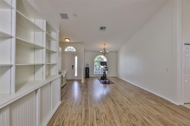 6332 35th Avenue Cir E, Palmetto, FL 34221 - entryway featuring light wood-type flooring, baseboards, and a chandelier
