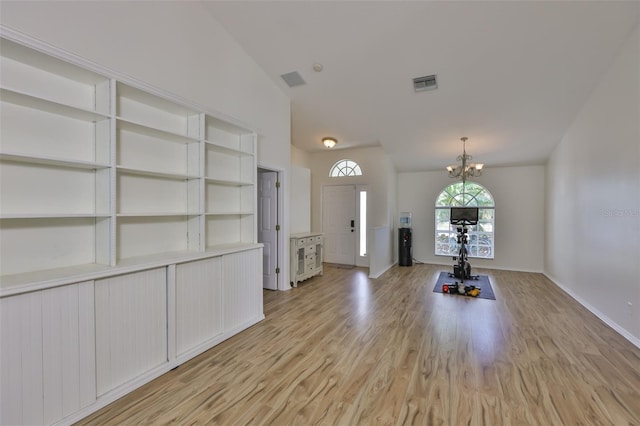 6332 35th Avenue Cir E, Palmetto, FL 34221 - foyer entrance featuring a chandelier, light wood-style flooring, lofted ceiling, and baseboards