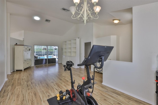 6332 35th Avenue Cir E, Palmetto, FL 34221 - workout room with a chandelier, vaulted ceiling, baseboards, and wood finished floors