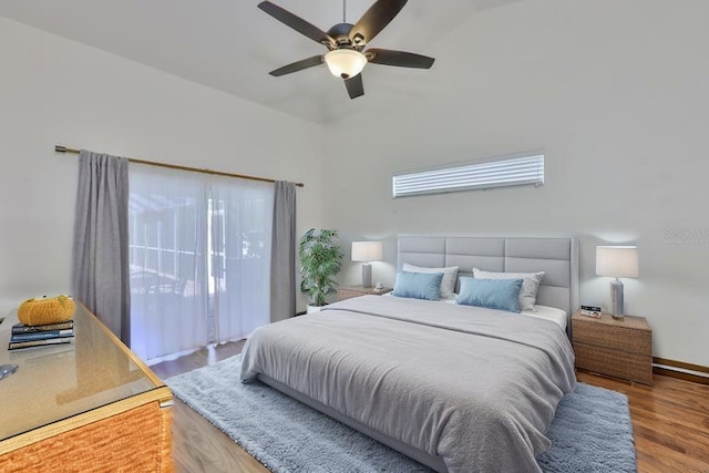 6332 35th Avenue Cir E, Palmetto, FL 34221 - bedroom with wood finished floors, access to exterior, lofted ceiling, a ceiling fan, and baseboards