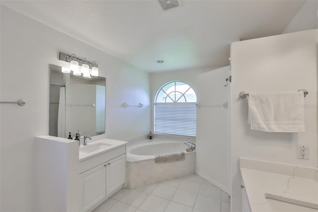 6332 35th Avenue Cir E, Palmetto, FL 34221 - bathroom with vanity, a garden tub, tile patterned flooring, and a shower