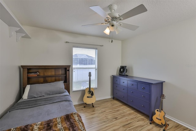 6332 35th Avenue Cir E, Palmetto, FL 34221 - bedroom featuring light wood-type flooring, baseboards, and a ceiling fan
