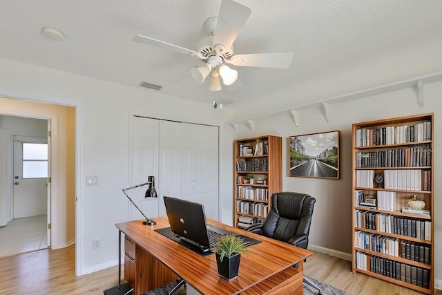 6332 35th Avenue Cir E, Palmetto, FL 34221 - home office with light wood-type flooring, a ceiling fan, and baseboards