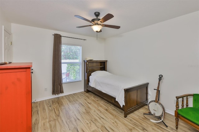 6332 35th Avenue Cir E, Palmetto, FL 34221 - bedroom with light wood-style flooring, baseboards, and a ceiling fan