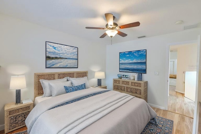 6332 35th Avenue Cir E, Palmetto, FL 34221 - bedroom featuring light wood-style floors, ceiling fan, and baseboards