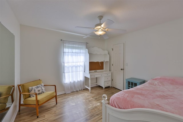 6332 35th Avenue Cir E, Palmetto, FL 34221 - bedroom with light wood finished floors, a ceiling fan, and baseboards