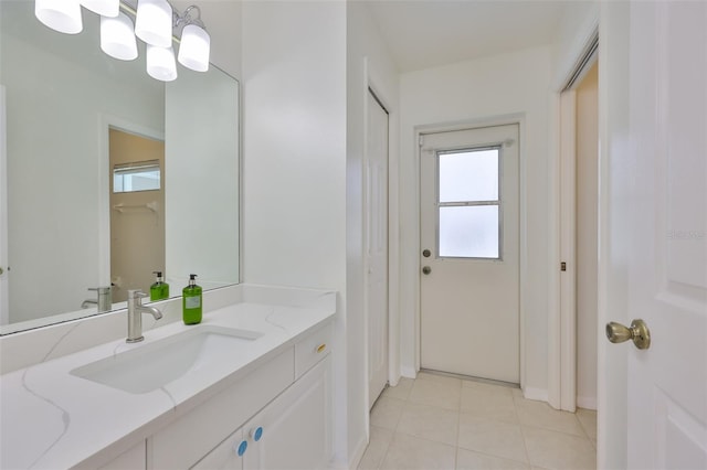 6332 35th Avenue Cir E, Palmetto, FL 34221 - bathroom featuring healthy amount of natural light, vanity, tile patterned floors, and baseboards