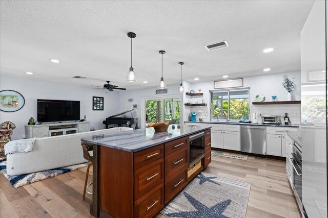 kitchen featuring dishwasher, open shelves, recessed lighting, black microwave, and backsplash