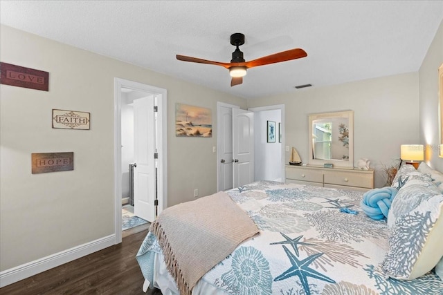 bedroom featuring dark wood-type flooring, baseboards, and ceiling fan