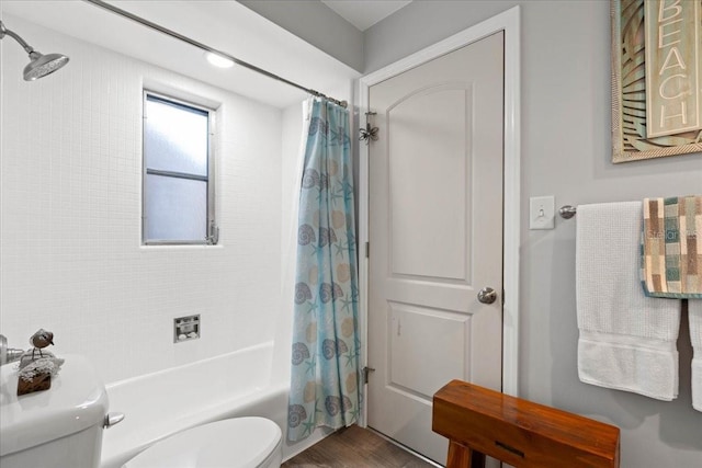 full bathroom with toilet, shower / tub combo, and wood finished floors