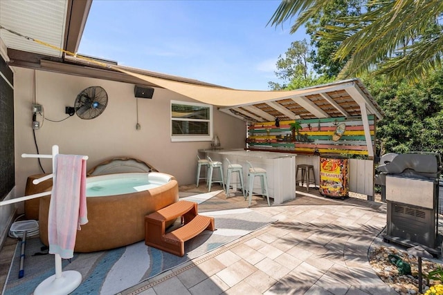 view of patio / terrace featuring a hot tub
