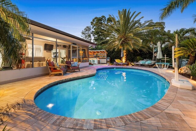 outdoor pool featuring a patio