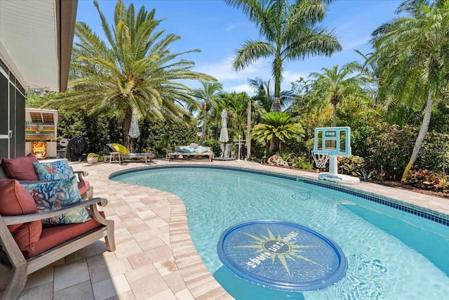 outdoor pool with a patio