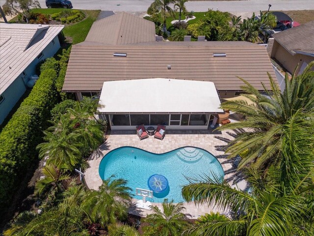 outdoor pool with a patio area
