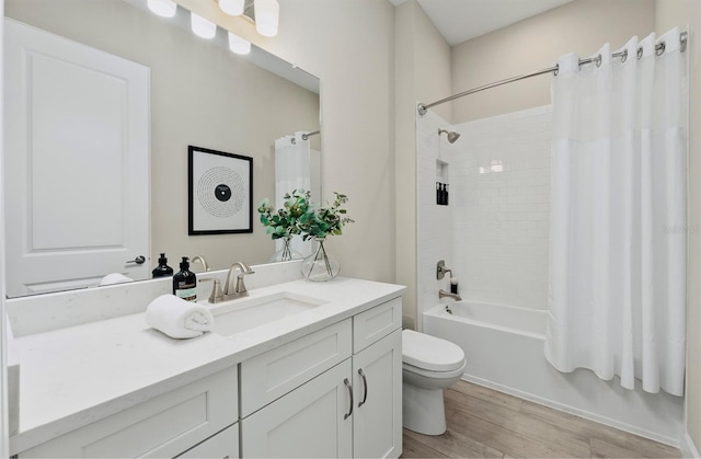 bathroom with vanity, shower / bath combo, toilet, and wood finished floors