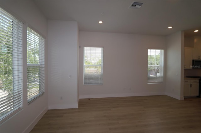 interior space with recessed lighting, baseboards, visible vents, and light wood-type flooring