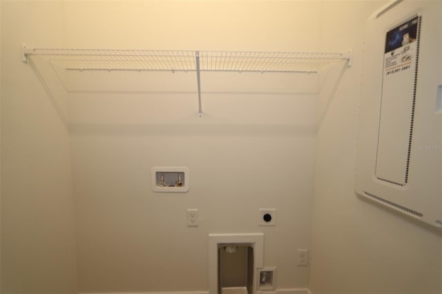 clothes washing area featuring washer hookup, baseboards, laundry area, and electric dryer hookup