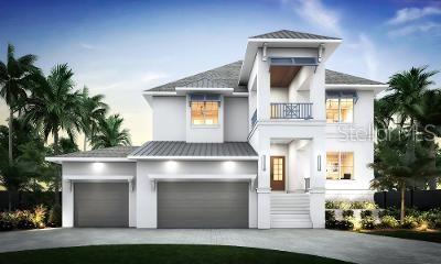 4 W Spanish Main St, Tampa, FL 33609 - view of front of house with a balcony, stucco siding, driveway, and a standing seam roof