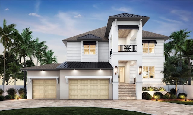 4 W Spanish Main St, Tampa, FL 33609 - view of front facade with a standing seam roof, decorative driveway, a balcony, and metal roof