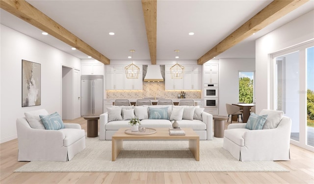 4 W Spanish Main St, Tampa, FL 33609 - living area featuring beam ceiling, plenty of natural light, light wood-style floors, and recessed lighting