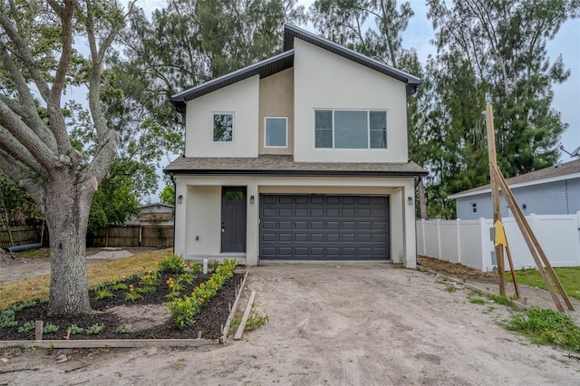 12484 Cross St, Largo, FL 33773 - view of front of property with a garage, stucco siding, and driveway