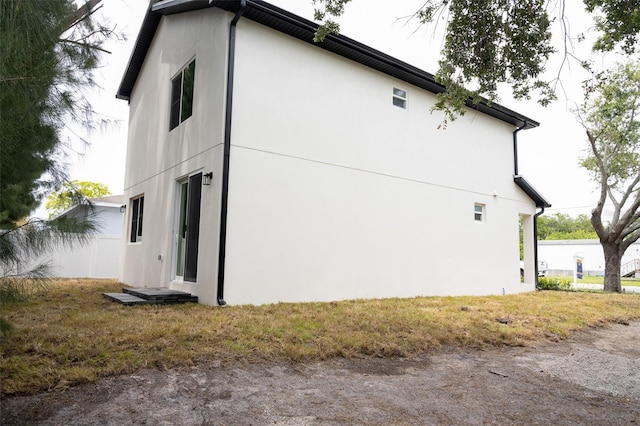 12484 Cross St, Largo, FL 33773 - view of side of property featuring stucco siding