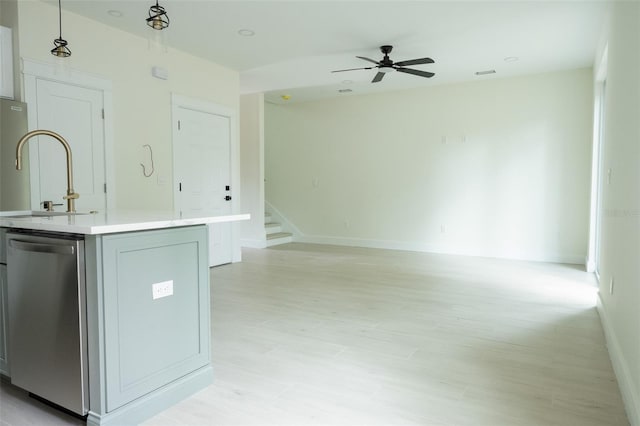 12484 Cross St, Largo, FL 33773 - kitchen with light countertops, dishwasher, open floor plan, a sink, and a ceiling fan