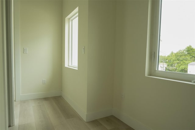 12484 Cross St, Largo, FL 33773 - spare room with wood finished floors and baseboards