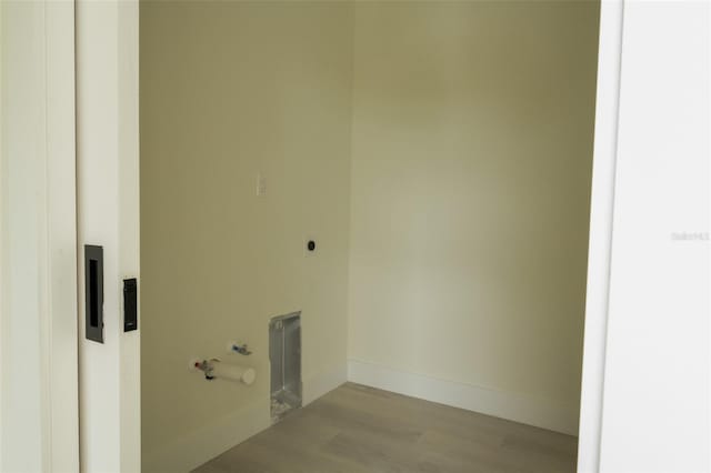 12484 Cross St, Largo, FL 33773 - washroom featuring wood finished floors and baseboards